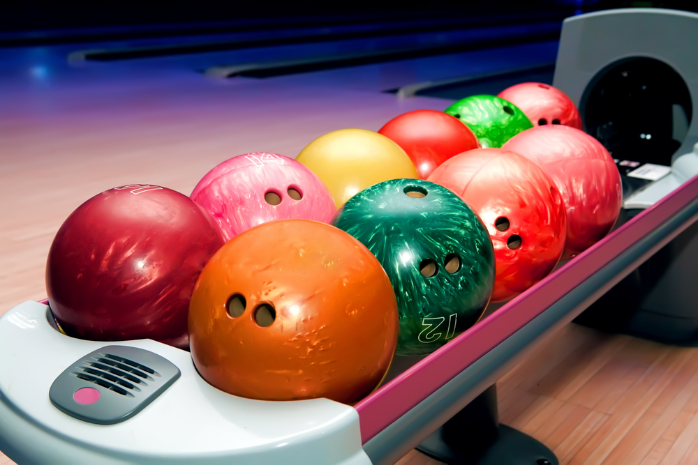 Bowling alley balls with large holes